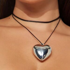 Necklace, NWT, Silvertone heart on black silklike string, statement necklace.